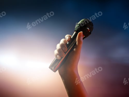 Preview: A singer on stage with a microphone