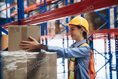 Preview: Worker in the warehouse checking the stock is on the shelves at the manufacturing.