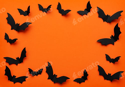 Preview: black paper bats flying over orange background