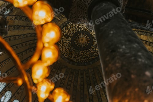 Preview: Ornate chandelier illuminating arabic calligraphy in hagia sophia's dome