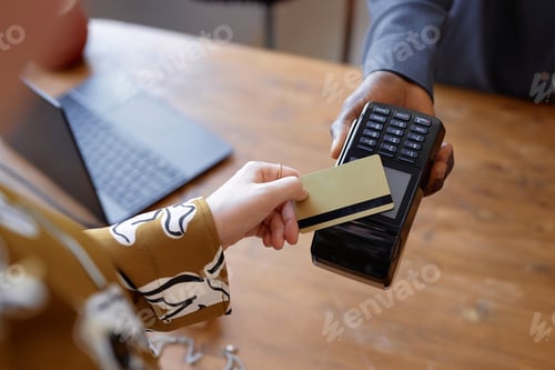 Preview: Woman Paying Contactless with Bank Card at Store Checkout