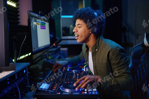 Preview: Young Man Mixing Music in Recording Studio