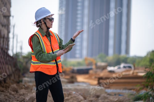 Preview: Engineer worker operations construction plans large black drainage pipe