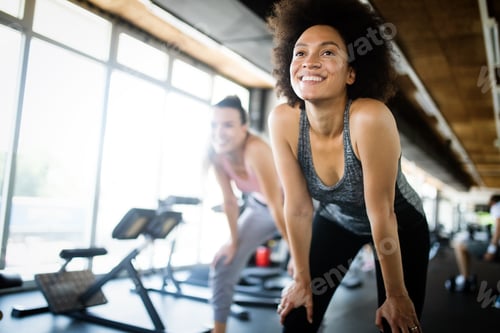 Preview: Close up image of attractive woman in gym