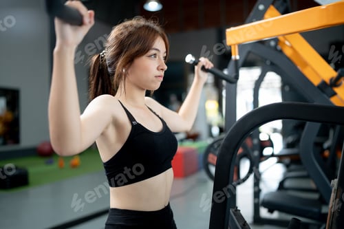 Preview: Young Woman Exercising in a Fitness Center