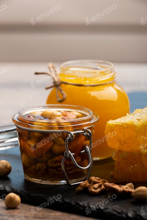 Preview: Honeyed assorted nuts in mason jar organic food background
