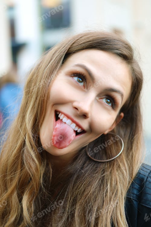 Preview: tricky girl making faces, sticking out tongue