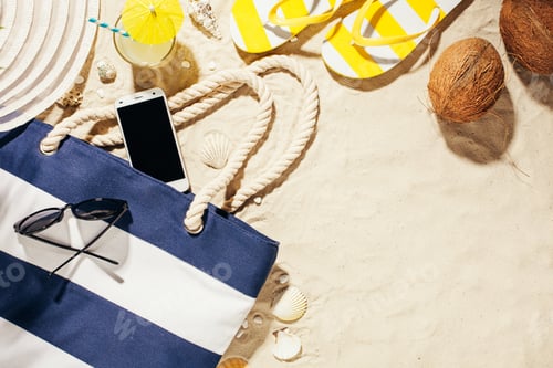 Preview: Hat, beach bag, sun glasses and glass of coconut water on a tropical beach