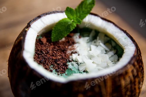 Preview: Smoothie bowl with blue spirulina, coconut flakes and chocalate with mint in coconut. Healthy food
