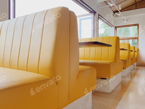 Preview: Yellow sofas in retro style diner restaurant