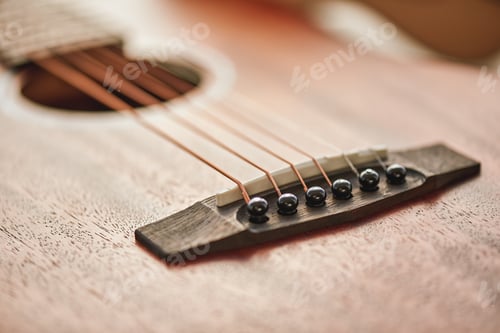Preview: Sound adjusting. Close up detailed photo of guitar strings and sound hole