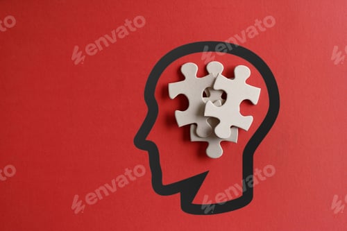 Preview: Scattered puzzles in human head with copy space on red background.
