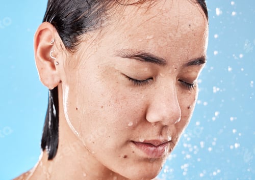 Preview: Shower, woman and water for wellness, health and hygiene for body care, wet and against blue studio