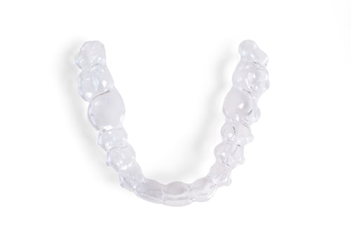 Preview: Invisible braces lying on a white background representing modern dental healthcare