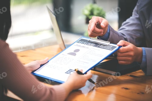 Preview: Woman submits her employer's resume to review job applications. Concept showcases her ability to get