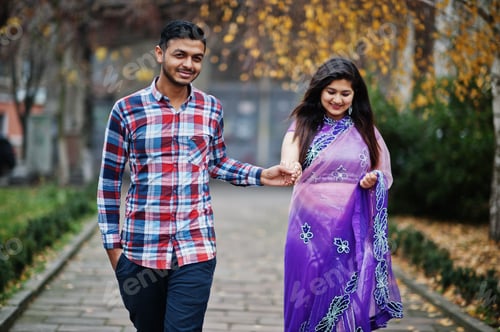 Preview: Stylish indian hindu couple posed on street.