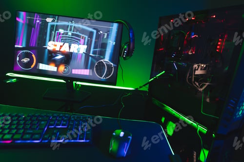 Preview: Composite of computer, keyboard with video game accessories with copy space on neon background