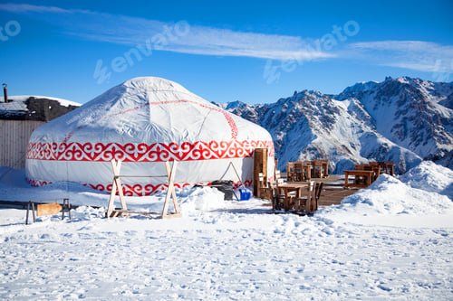 Preview: Restoran from yurt house in the mountains against the backdrop of snow mountains