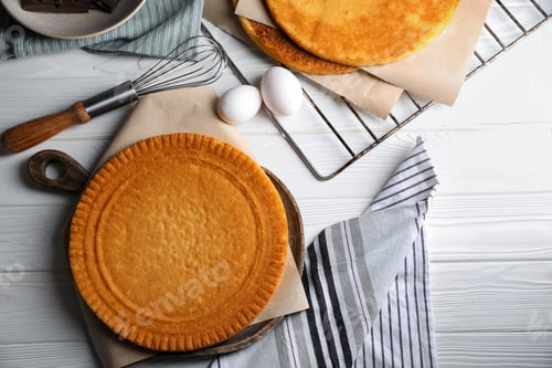 Preview: Ingredients for delicious homemade layer cake preparing on white wooden table, flat lay