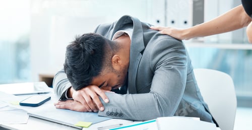 Preview: Excuse me, please wake up...Shot of a young businessman sleeping at his desk in an office.
