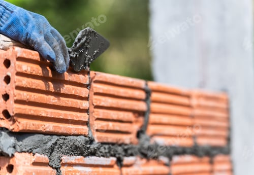 Preview: Hand worker masonry brickwork trowel construction site wall concrete background