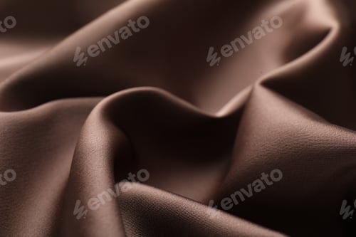 Preview: Crumpled light brown silk fabric as background, closeup