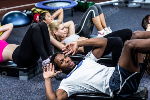Preview: Group Of People Working Their Abs In Gym