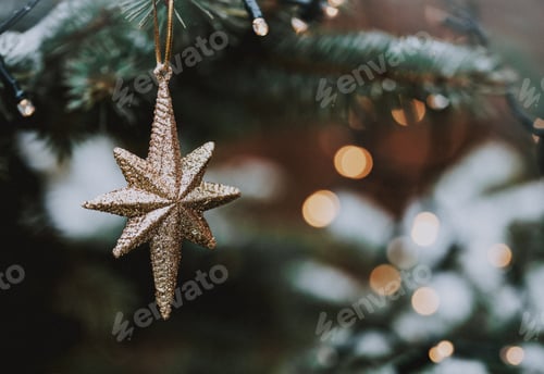 Preview: golden christmas ornament on fir tree