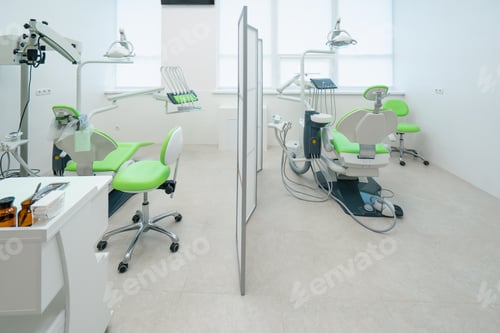 Preview: empty modern white green dentist's office in clinic computer equipment professional dental chair