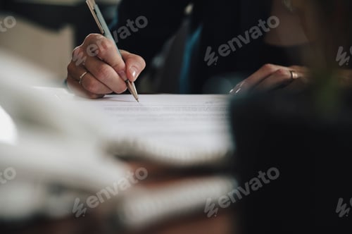 Preview: Low angle view of a businesswoman signing a contract