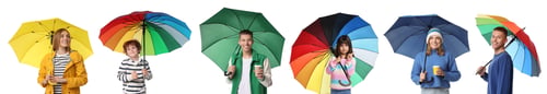 Preview: Adults and kids with bright umbrellas on white background