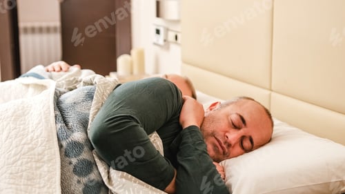 Preview: Happy gay couple sleeping relaxed at home