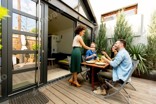 Preview: Cheerful young people have lunch in the courtyard and a fun