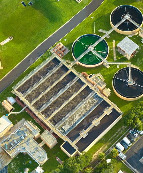 Preview: Aerial view of modern water cleaning facility at urban wastewater treatment plant.