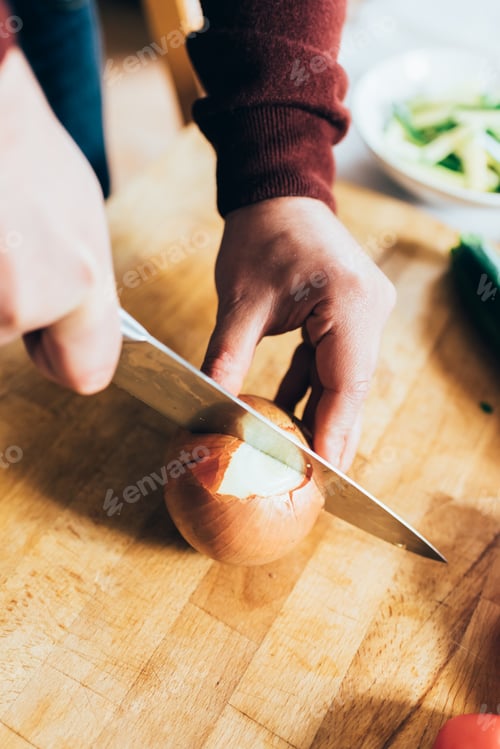 Preview: Close up hand cutting onion