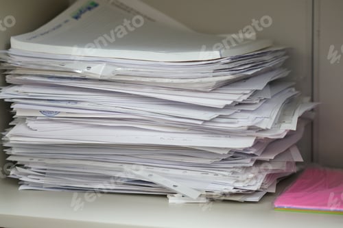 Preview: Documents and papers in a pile, documents in an office