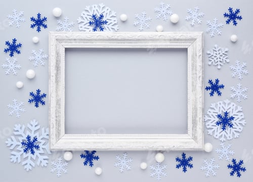 Preview: Christmas background. Photo frame and snowflakes on white background. Flat lay, top view, copy space