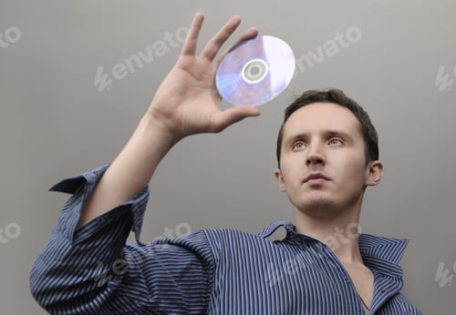 Preview: Man With Compact Disc In Hand