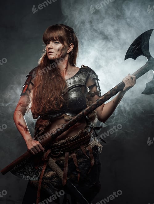 Preview: Serious woman viking with axe in dark foggy background