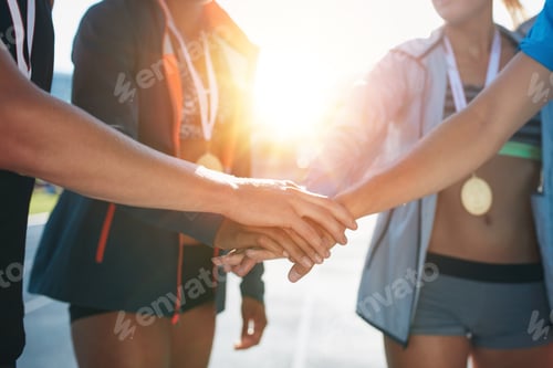 Preview: Team with hands together celebrating success