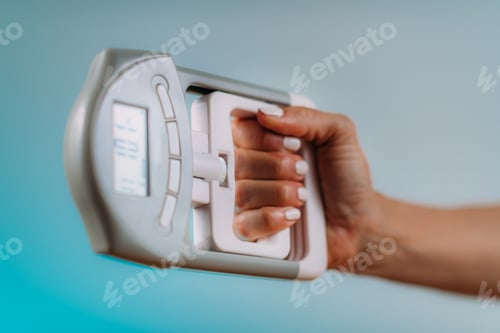Preview: Woman with Digital Hand Grip Dynamometer, Measuring Strength