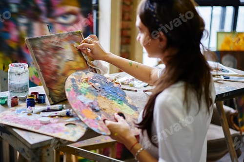 Preview: Caucasian woman inspired during masterpiece artwork in gallery drawing picture indoors