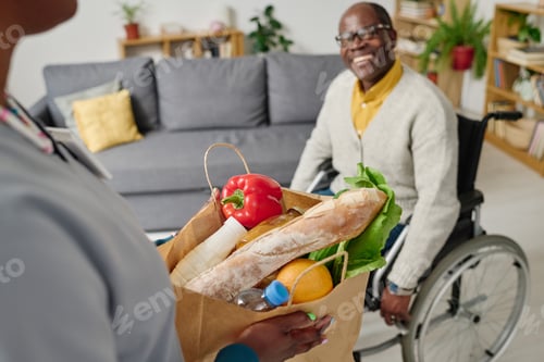 Preview: Caregiver delivering food to man with disability