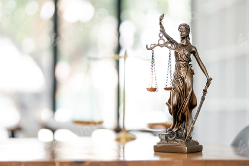 Preview: Statue of Lady Justice with scales of justice on wooden table. image statue of lady justice.