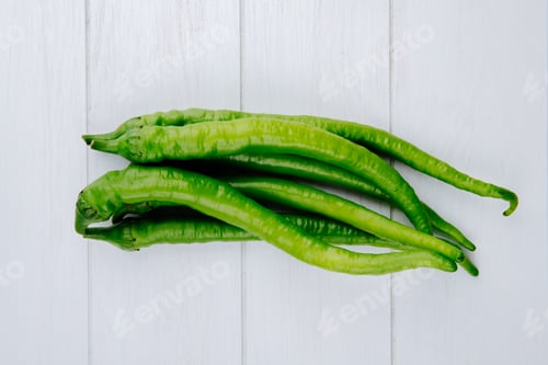Preview: top view of green chili peppers isolated on white background