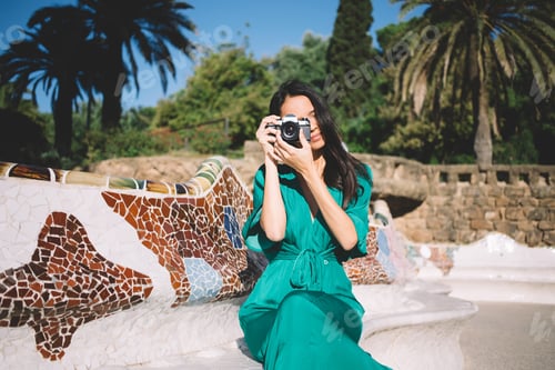 Preview: Woman taking photo on camera