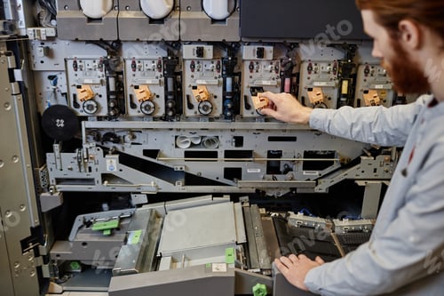 Preview: Worker Using Printing Machine