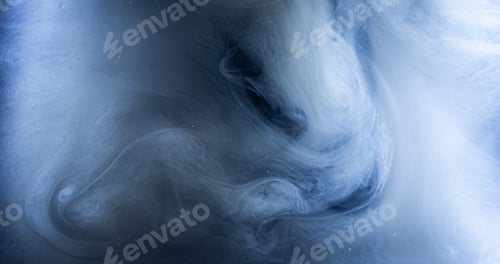 Preview: Artistic shot of a whitish blue smoke in swirly patterns
