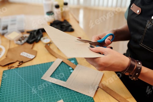 Preview: Woman Cutting out Cardboard Patterns