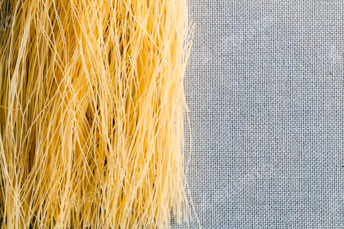 Preview: Bavette pasta spaghetti on a burlap cloth with a dark background with space for the recipe.